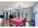 Dining room featuring a table with seating and french doors leading to an outdoor space at 1639 W Indianola Ave, Phoenix, AZ 85015
