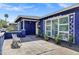 Exterior view of the home featuring a cozy bench at 1639 W Indianola Ave, Phoenix, AZ 85015