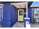 Charming front porch with a yellow door and visible house number at 1639 W Indianola Ave, Phoenix, AZ 85015