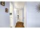Hallway with hardwood floors and access to rooms at 1639 W Indianola Ave, Phoenix, AZ 85015