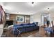 Spacious living room with brick accent wall, ample natural light, and modern furniture at 1639 W Indianola Ave, Phoenix, AZ 85015