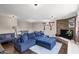 Comfortable living room with a large sectional sofa, brick fireplace, and soft lighting at 1639 W Indianola Ave, Phoenix, AZ 85015