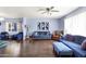 Bright and airy living room with hardwood floors, stylish decor, and comfortable seating at 1639 W Indianola Ave, Phoenix, AZ 85015