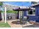 Inviting patio with pergola, grill, and outdoor dining set perfect for entertaining at 1639 W Indianola Ave, Phoenix, AZ 85015