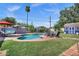 Expansive backyard featuring a large pool, lounge chairs, and patio area at 1639 W Indianola Ave, Phoenix, AZ 85015
