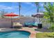 Inviting pool area with comfortable lounge seating and shade umbrellas at 1639 W Indianola Ave, Phoenix, AZ 85015