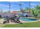 Relaxing poolside oasis with seating and a fire pit for cool evenings at 1639 W Indianola Ave, Phoenix, AZ 85015