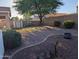Large backyard with a storage shed, mature trees, and landscaping creating a private outdoor space at 17328 W Pinnacle Vista Dr Dr, Surprise, AZ 85387