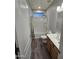 Clean bathroom with a tub-shower combo, wood-look floors, and a single vanity at 17328 W Pinnacle Vista Dr Dr, Surprise, AZ 85387