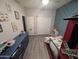 Cozy bedroom with a train-themed bed, light gray walls, and wood-look floors at 17328 W Pinnacle Vista Dr Dr, Surprise, AZ 85387