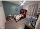 Charming bedroom featuring a themed bed frame, an accent wall and a ceiling fan at 17328 W Pinnacle Vista Dr Dr, Surprise, AZ 85387