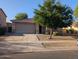 Charming home featuring a neutral color palette, a two-car garage, and a well-manicured desert landscape at 17328 W Pinnacle Vista Dr Dr, Surprise, AZ 85387