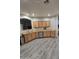 Kitchen area with wood cabinets, stainless steel appliances, hardwood flooring and ample counter space at 17328 W Pinnacle Vista Dr Dr, Surprise, AZ 85387
