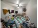 Spacious playroom with colorful floor tiles, a ball pit, and various toys for imaginative play at 17328 W Pinnacle Vista Dr Dr, Surprise, AZ 85387