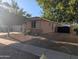 Charming home featuring a neutral color palette, desert landscaping, and a black fence at 17328 W Pinnacle Vista Dr Dr, Surprise, AZ 85387
