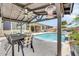 Inviting backyard showcasing a sparkling pool, covered patio, and outdoor dining area, ideal for entertaining at 17815 W Straight Arrow Ln, Surprise, AZ 85387