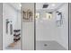 Sleek bathroom with walk-in shower, built-in storage, and stylish tile accents at 17815 W Straight Arrow Ln, Surprise, AZ 85387