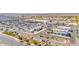 Commercial center with parking and eateries, set in a busy area surrounded by housing and desert views at 17815 W Straight Arrow Ln, Surprise, AZ 85387