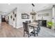 Dining room with wooden table, six chairs, chandelier, and stylish decor at 17815 W Straight Arrow Ln, Surprise, AZ 85387