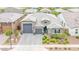 Beautiful home with a three-car garage and manicured landscaping enhances curb appeal in a desirable neighborhood at 17815 W Straight Arrow Ln, Surprise, AZ 85387