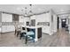 Gourmet kitchen boasts stainless steel appliances and bright white cabinetry at 17815 W Straight Arrow Ln, Surprise, AZ 85387