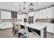 Spacious kitchen with a large island, modern lighting, and stainless steel appliances at 17815 W Straight Arrow Ln, Surprise, AZ 85387