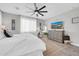 Bright main bedroom with modern furnishings, stylish dresser, and neutral tones at 17815 W Straight Arrow Ln, Surprise, AZ 85387