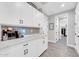 Mud room featuring white cabinets and view to the walk-in closet at 17815 W Straight Arrow Ln, Surprise, AZ 85387
