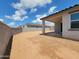 Spacious backyard with block wall and covered patio, ready for your personal touch at 19152 N Bandin Dr, Maricopa, AZ 85138