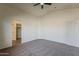 Spacious carpeted bedroom with an adjoining full bathroom and closet at 20761 N Herbert Ave, Maricopa, AZ 85138