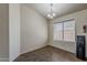 Neutral dining room featuring tile flooring and a chandelier above at 20761 N Herbert Ave, Maricopa, AZ 85138