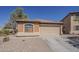 Single-story home with desert landscaping and a neutral color palette at 20761 N Herbert Ave, Maricopa, AZ 85138