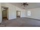 Bright living room featuring tile entry, vaulted ceiling, and windows for natural light at 20761 N Herbert Ave, Maricopa, AZ 85138