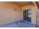 Covered patio features a sliding glass door, offering seamless indoor-outdoor living at 20761 N Herbert Ave, Maricopa, AZ 85138