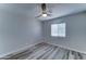 Clean bedroom featuring a ceiling fan, window, and neutral paint at 2148 W Hayward Ave, Phoenix, AZ 85021