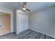 Bedroom with ceiling fan, closet, and doorway leading to another room at 2148 W Hayward Ave, Phoenix, AZ 85021
