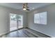 Bright bedroom with sliding glass doors and modern ceiling fan at 2148 W Hayward Ave, Phoenix, AZ 85021