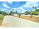 Charming home with a large front yard, gated entrance, and a long driveway at 2148 W Hayward Ave, Phoenix, AZ 85021