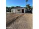 Inviting single-story home featuring a red front door, xeriscaped yard, and a covered entrance at 2148 W Hayward Ave, Phoenix, AZ 85021