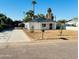 Charming single-story home with well-manicured lawn, palm trees, and a lovely entrance with fresh driveway at 2148 W Hayward Ave, Phoenix, AZ 85021