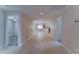 Hallway featuring tile flooring leading to living areas with updated kitchen and bedroom at 2148 W Hayward Ave, Phoenix, AZ 85021
