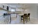 Updated kitchen with white cabinets, granite countertops, and an island with bar seating at 2148 W Hayward Ave, Phoenix, AZ 85021