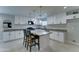 Modern kitchen featuring white cabinets, granite counters, stainless appliances, and a central island at 2148 W Hayward Ave, Phoenix, AZ 85021