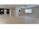 Bright and airy living room with neutral tile flooring and modern ceiling fan at 2148 W Hayward Ave, Phoenix, AZ 85021