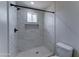 Bathroom shower with white marble tile and black hardware at 2148 W Hayward Ave, Phoenix, AZ 85021