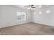 Large bedroom with natural light, a ceiling fan, and neutral paint at 22672 W Solano Dr, Buckeye, AZ 85326