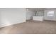 Spacious bonus room with plush carpet, and ample lighting throughout at 22672 W Solano Dr, Buckeye, AZ 85326