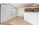 Dining area with tile floors, ample natural light, and access to the kitchen at 22672 W Solano Dr, Buckeye, AZ 85326