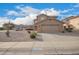 Two-story home featuring a neutral palette, large garage, and low-maintenance desert landscaping at 22672 W Solano Dr, Buckeye, AZ 85326