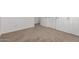 Hallway with carpeted flooring with doors leading to various rooms in the home at 22672 W Solano Dr, Buckeye, AZ 85326